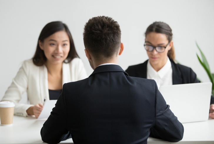 male-candidate-interviewed-by-diverse-hr-team